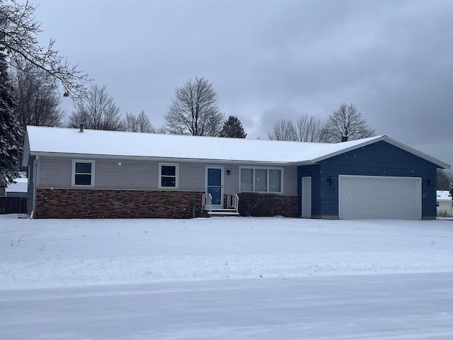 ranch-style house featuring a garage