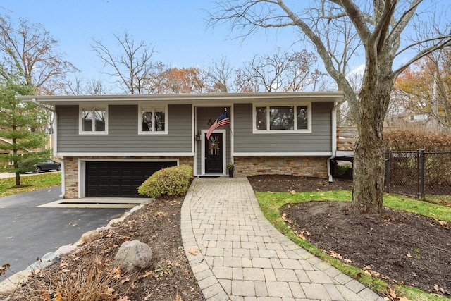 raised ranch featuring a garage