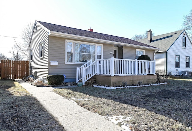 single story home featuring cooling unit