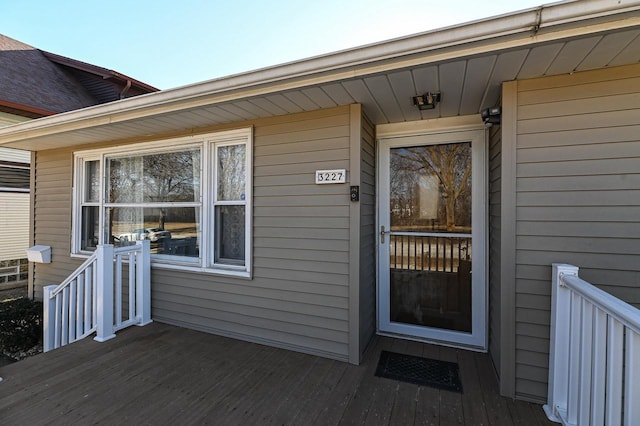 entrance to property with a wooden deck