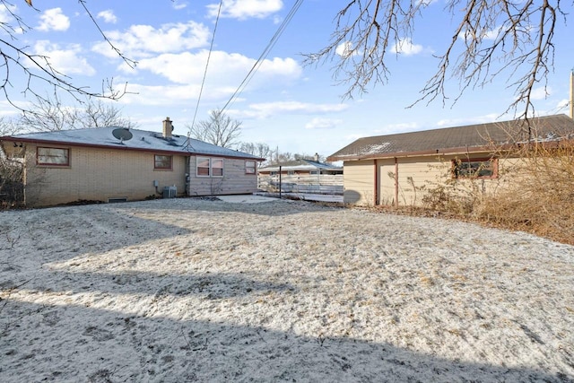 rear view of property featuring central air condition unit