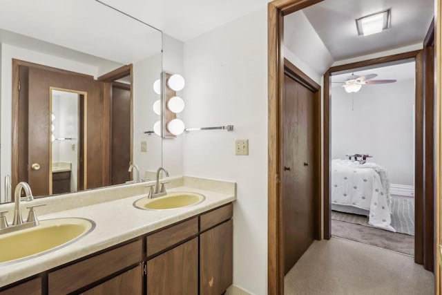 bathroom with ceiling fan and vanity