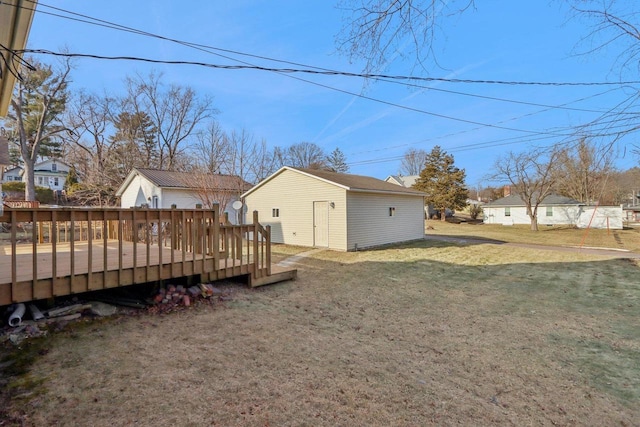 view of yard with an outdoor structure and a wooden deck