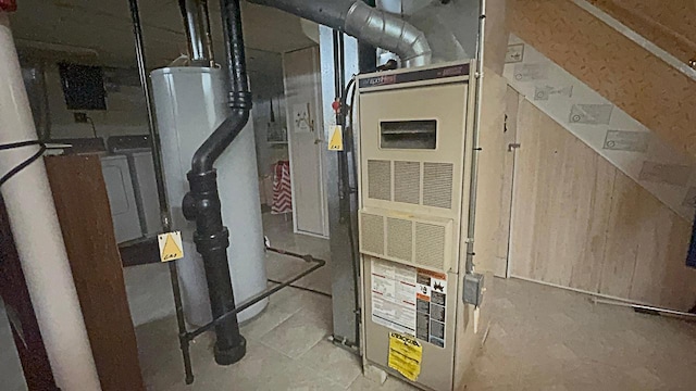 utility room featuring heating unit