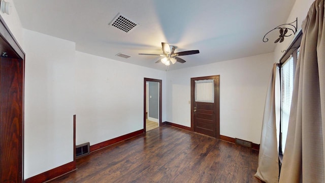 unfurnished bedroom with ceiling fan and dark hardwood / wood-style flooring