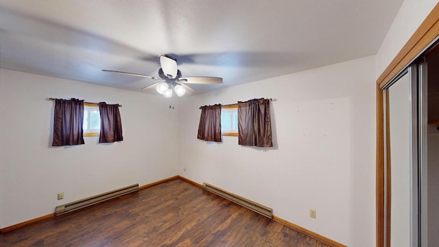 unfurnished room with ceiling fan, dark hardwood / wood-style flooring, and a baseboard radiator