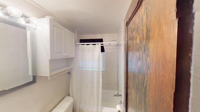 bathroom featuring crown molding and shower / bath combination with curtain