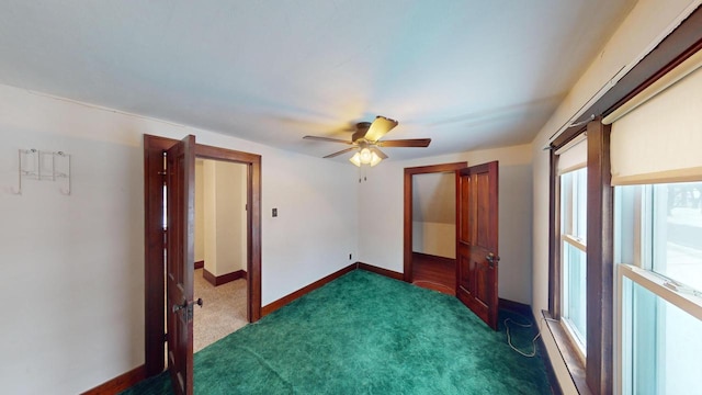 carpeted empty room with ceiling fan