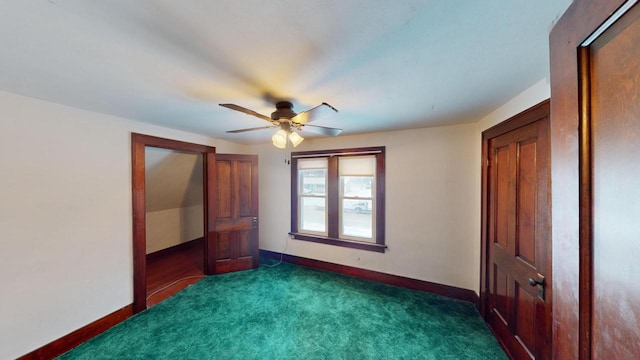 unfurnished bedroom with dark carpet and ceiling fan