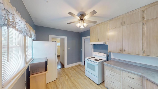 kitchen featuring ceiling fan, light brown cabinetry, white appliances, and light wood-type flooring