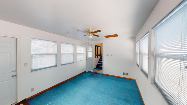 interior space featuring a wealth of natural light and ceiling fan