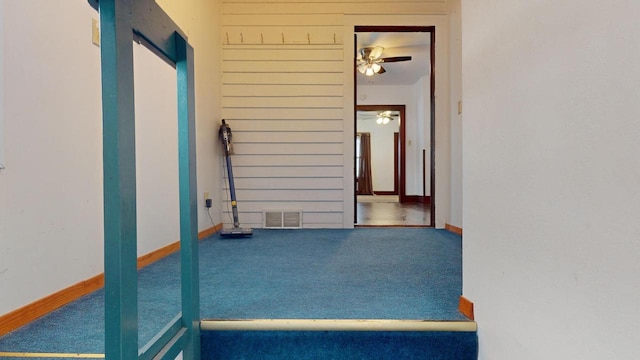 hallway with carpet floors