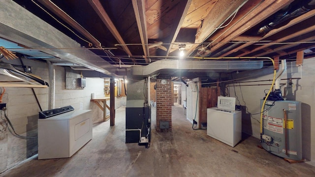 basement featuring separate washer and dryer, heating unit, and gas water heater