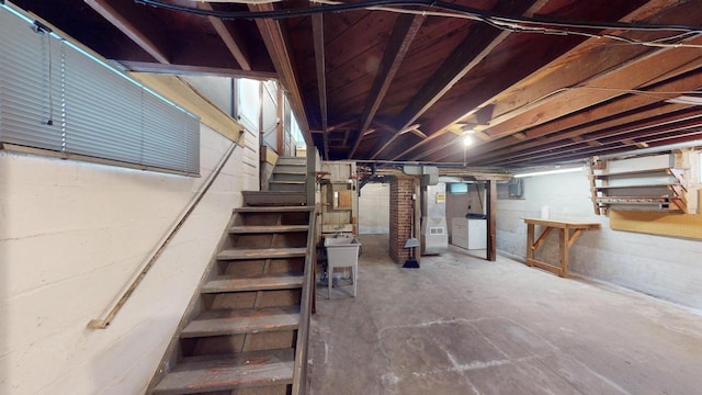 basement featuring washer / dryer and heating unit