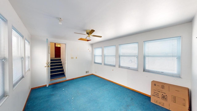 interior space featuring ceiling fan