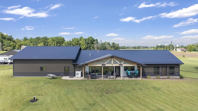 back of property featuring a yard and a patio area