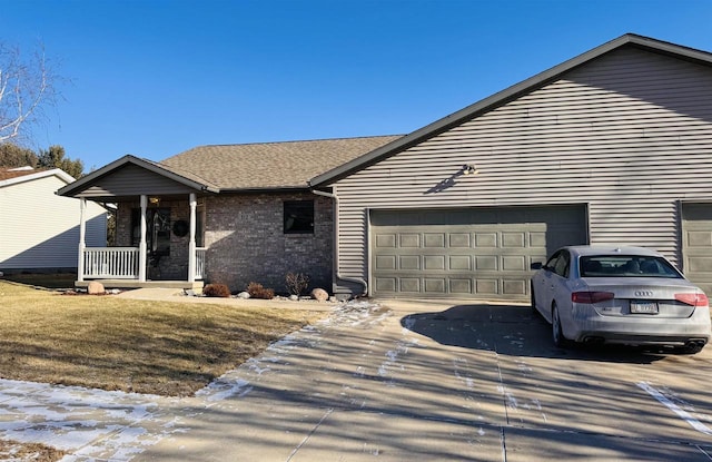 ranch-style home with a garage and a porch