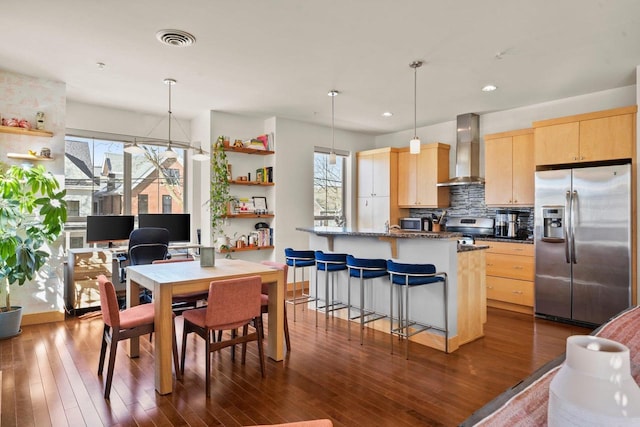 dining room featuring dark hardwood / wood-style flooring