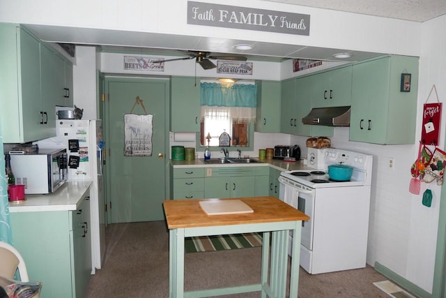 kitchen with sink, white appliances, ceiling fan, and green cabinets