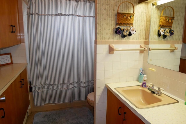 full bathroom with tile walls, shower / bath combination, toilet, and vanity