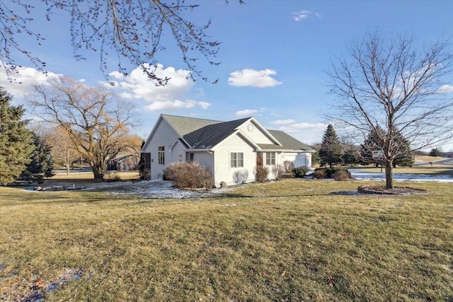 view of side of property featuring a yard