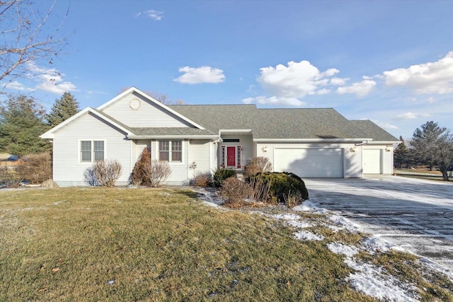 ranch-style home with a front yard and a garage