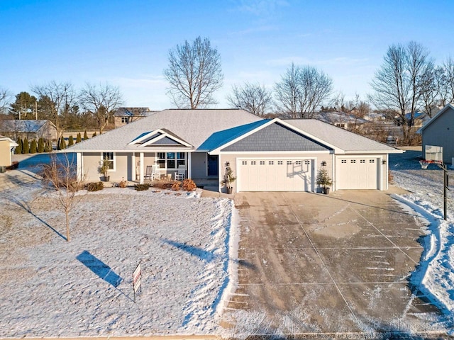 ranch-style house featuring a garage