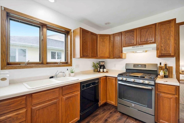 kitchen with dishwasher, dark hardwood / wood-style flooring, sink, and stainless steel gas range