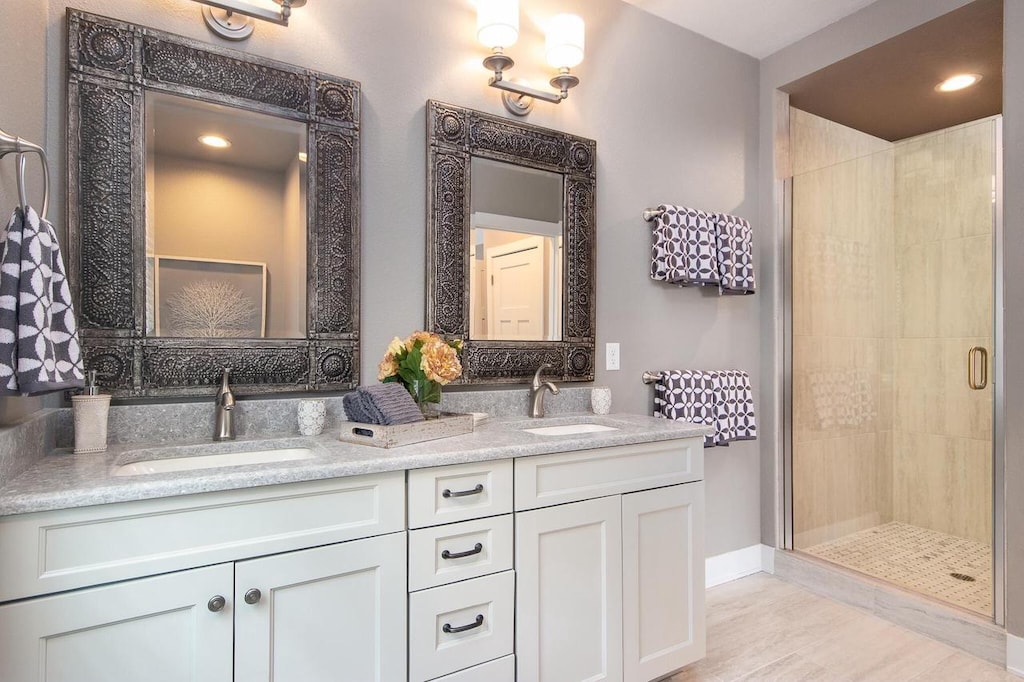 bathroom with vanity and walk in shower