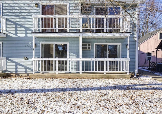 back of house with a balcony