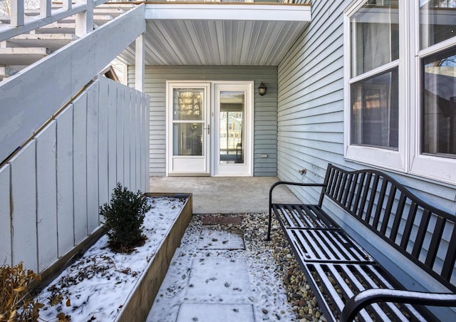 view of snow covered property entrance