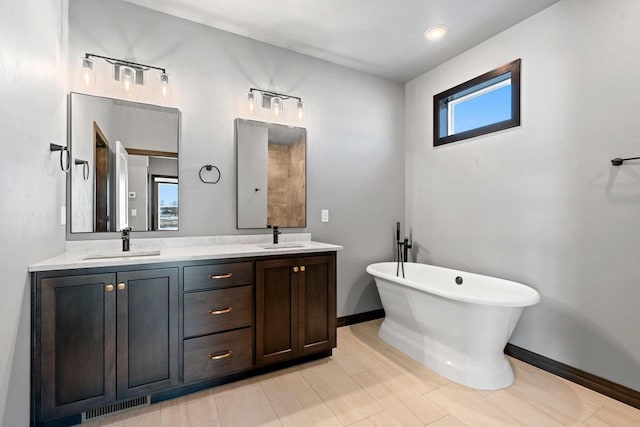 bathroom featuring vanity and a bathing tub