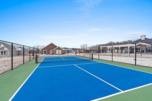 view of sport court featuring basketball hoop