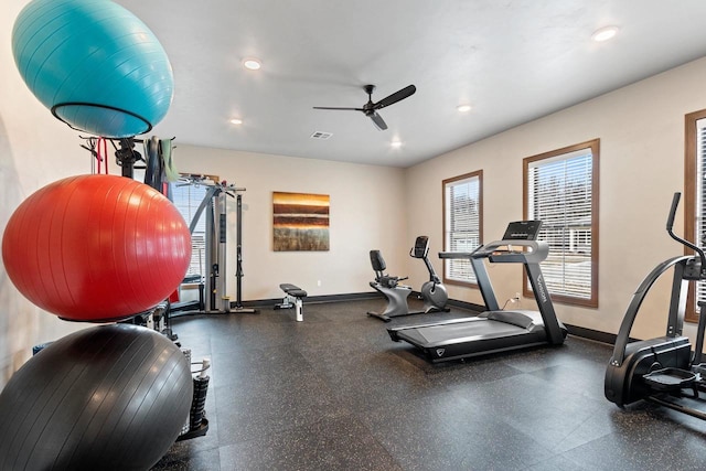 workout area with ceiling fan and a healthy amount of sunlight