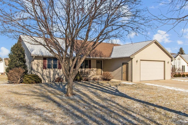 ranch-style house featuring a garage