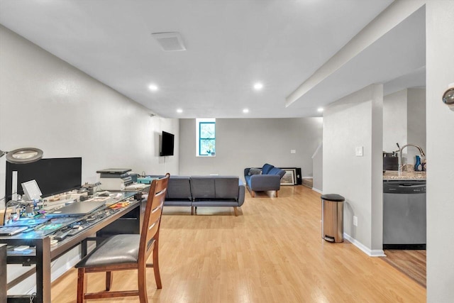 office with light hardwood / wood-style flooring