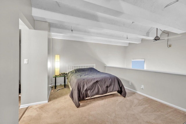 bedroom featuring beamed ceiling and light carpet