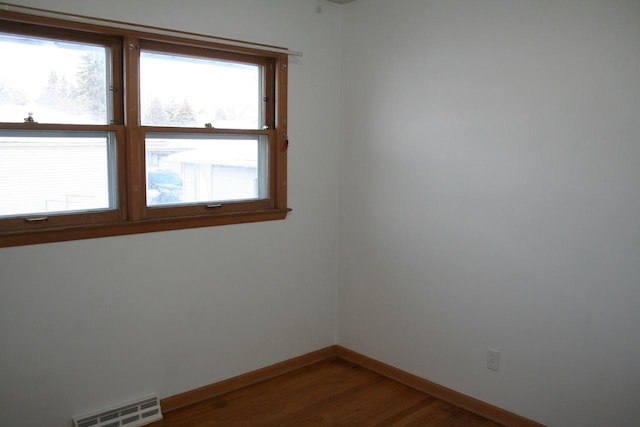 empty room featuring wood-type flooring