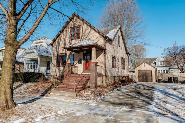 view of front facade with an outdoor structure, a porch, and a garage