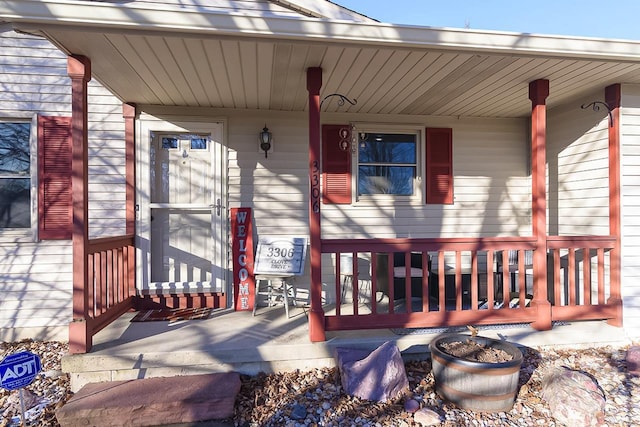 wooden deck featuring covered porch