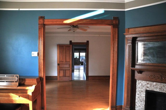 interior space with wood-type flooring and ornamental molding