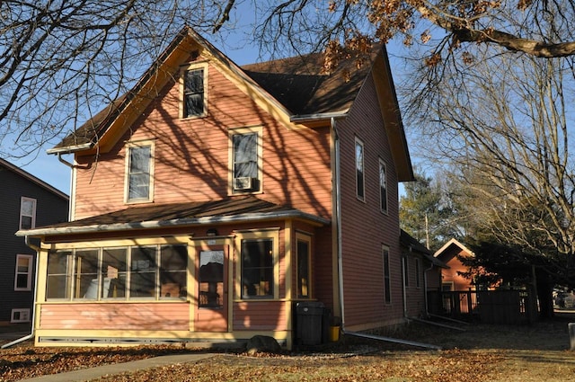 back of property featuring a sunroom