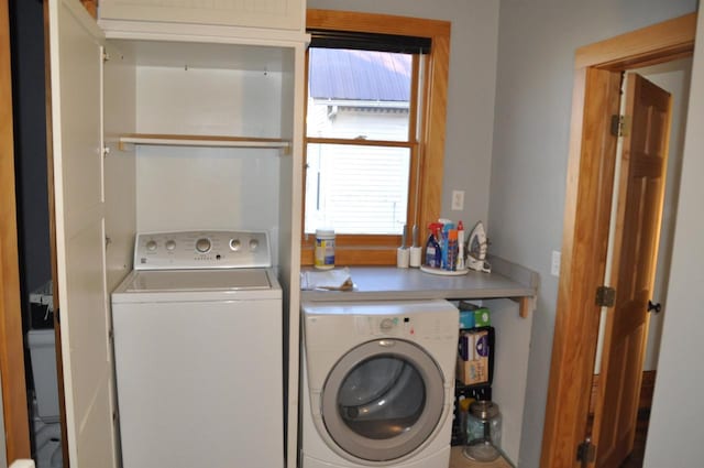 laundry room with washer and clothes dryer