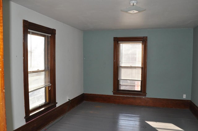 empty room with hardwood / wood-style flooring