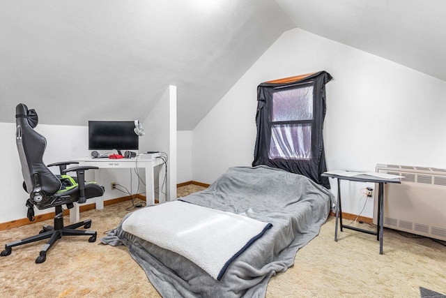 carpeted bedroom featuring radiator heating unit and vaulted ceiling