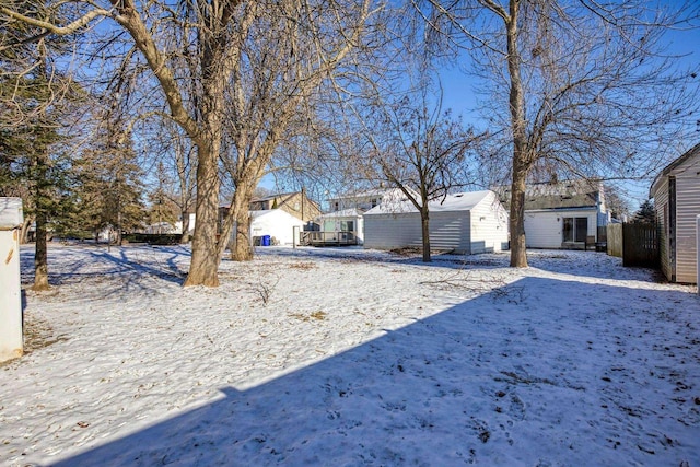 view of yard layered in snow