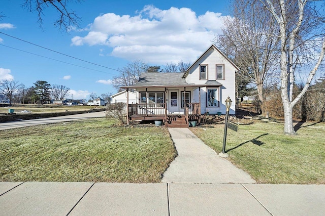 view of front facade with a front lawn and a porch