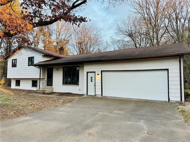 split level home featuring a garage