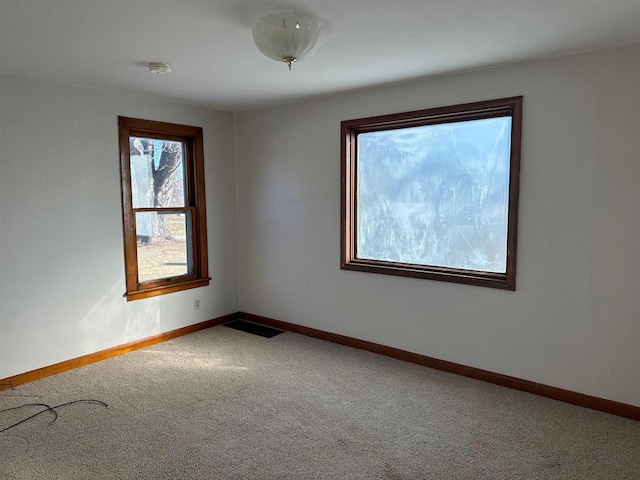 unfurnished room with carpet floors