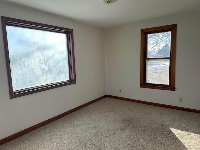 unfurnished room featuring carpet floors